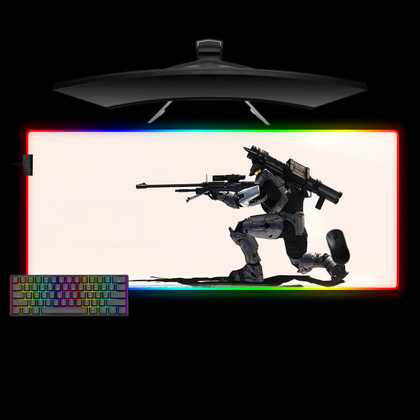 Gaming desk setup with an xl size RGB lit mouse pad featuring a Halo Sniper design, keyboard, and monitor.